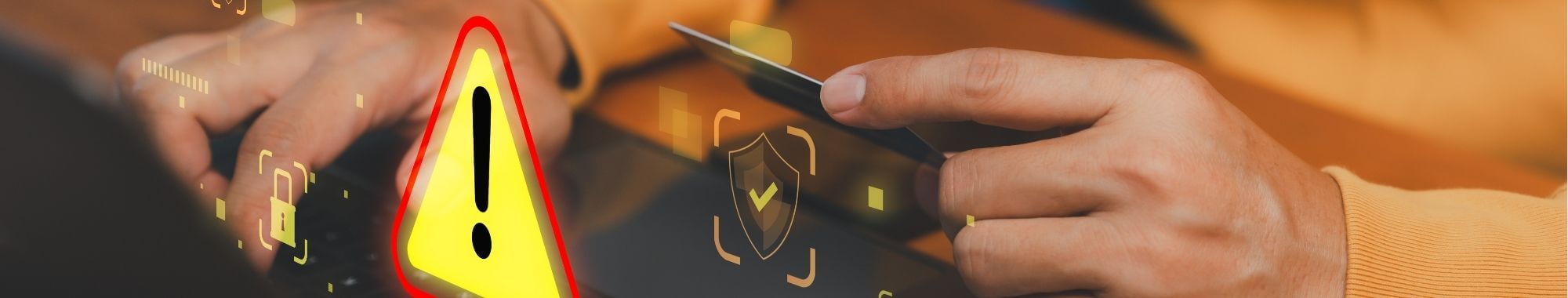 Man's hands on laptop keys with cybersecurity graphics.