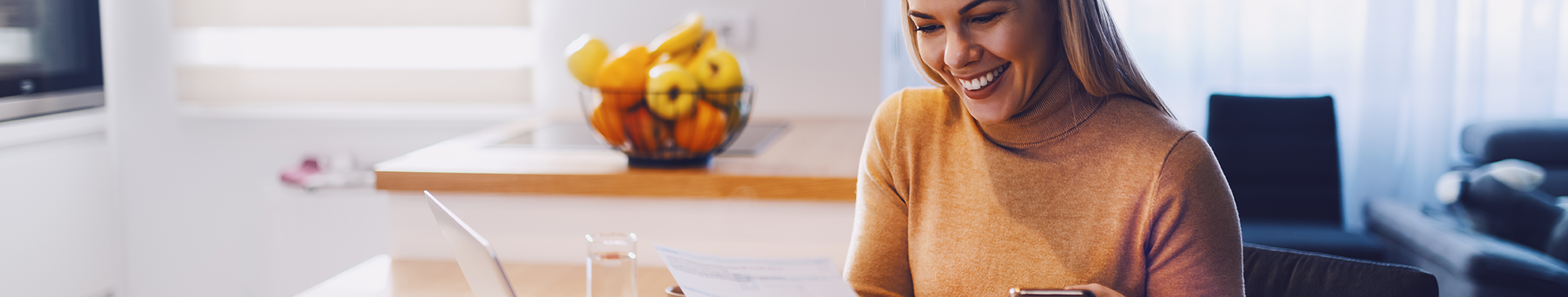 Woman on phone and reviewing document